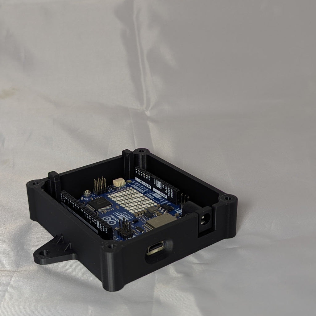 Black electronic enclosure with lid removed on a white background