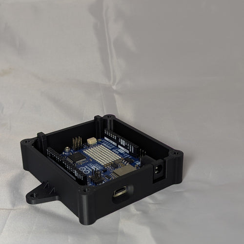 Black electronic enclosure with lid removed on a white background