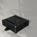 Black electronics enclosure with white text for status LED ports on a white background
