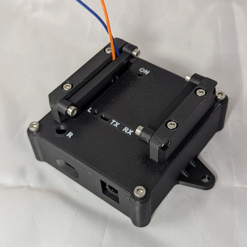 Black electronic enclosure with labeled status LED ports on a white background