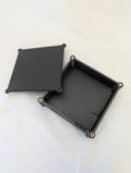 A black electronics enclosure with the lid removed and off to one side.